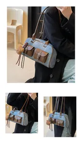 Detail view of denim pillow bag with leather pockets and cute teddy bear charm