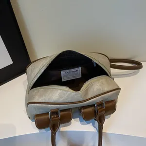 Retro multi-pocket pillow bag in grey canvas and brown leather with shoulder straps