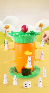 Close-up of carrot balance tower game with bunny pieces and numbered dice for kids