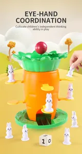 Close-up of kids carrot balance tower game showing rabbit figures and multi-tier leaves