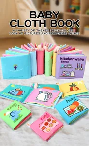Detailed close-up of soft educational cloth books with bilingual fruit and animal themes