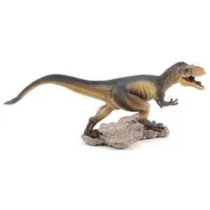 Modelo realista de dinosaurio carnívoro con piel texturizada y base rocosa decorativa