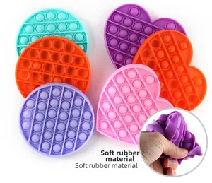Detail showing soft silicone texture and flexible squeeze feature of pop it keychains