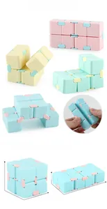 Macro view of macaron Infinity Cube showing size measurements and folding mechanisms