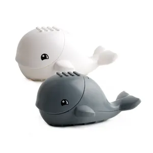 Cartoon whale building block figures in white and dark grey colors for ocean play