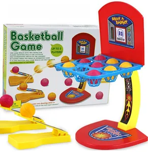 Close-up of mini desktop basketball game with scoring grid and dual catapult launchers