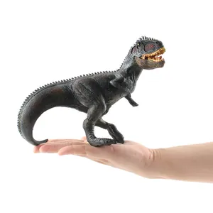 Realistic Giganotosaurus dinosaur toy held in hand showing detailed skin texture