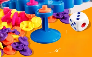 Close-up of colorful stacking pieces and dice for the tabletop balance board game