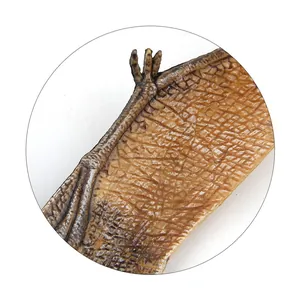 Close-up of realistic Pterosaur toy showing skin texture and sharp wing claws