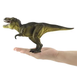 Detailed realistic T-Rex dinosaur model with textured skin held in hand for scale