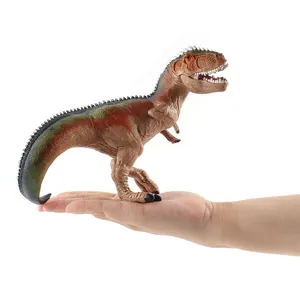 Detailed Giganotosaurus dinosaur toy model held in hand for size demonstration