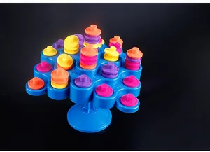 Detail of colorful stacking blocks on a balanced blue tray for educational puzzle gameplay