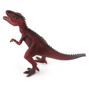Macro detail of red Giganotosaurus dinosaur toy showing textured scales and sharp teeth