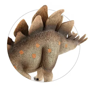 Macro shot of Stegosaurus toy showing realistic brown skin scales and orange dorsal plates