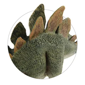 Detailed view of dark green skin texture and brown dorsal plates on a Stegosaurus toy