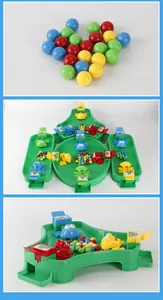 Close-up of four-player feeding frog board game with colorful plastic beads and base
