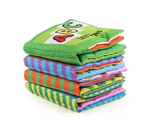 Detailed stack of four colorful ABC soft baby cloth books with high-quality stitching