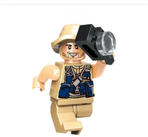 Detailed view of explorer minifigure with sun hat holding a camera accessory