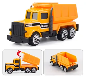 Détail d'un camion benne jouet jaune avec plateau mobile montrant le mécanisme de levage