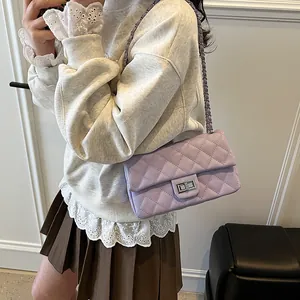 Chic lavender quilted crossbody bag with silver chain strap and metal turn-lock closure