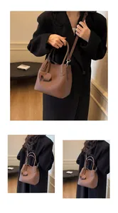 Detailed macro view of brown lychee-patterned leather bucket bag with cute elephant charm