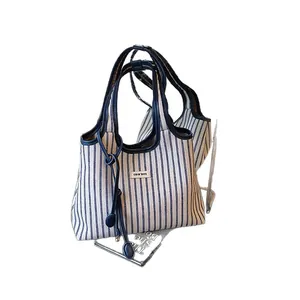 Striped canvas tote bag with leather trim and large capacity for casual daily use