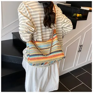 Close-up of the colorful bohemian woven tote bag showing its fine texture and leather strap