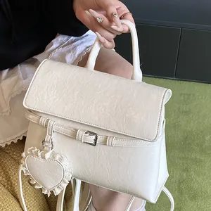 Chic cream white leather backpack for women with vintage texture and heart charm