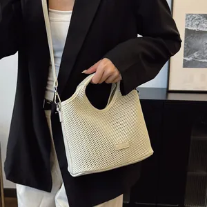Minimalist beige mesh tote bag with textured knit design and elegant shoulder strap