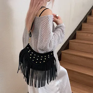 Retro black fringe crossbody bag with gold studs and bohemian tassel detail for women