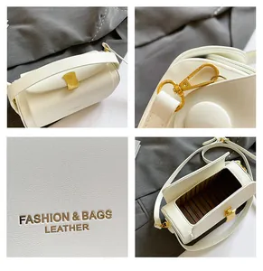 Vue détaillée du sac blanc avec boucle en métal doré et texture en cuir fin