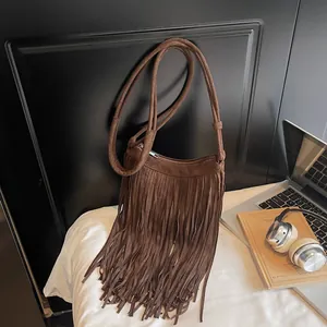 Vintage brown suede fringe crossbody bag with retro bohemian style and soft texture