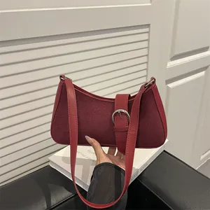 Retro burgundy suede patchwork underarm bag with silver metal buckle and shoulder strap