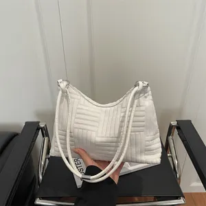 Minimalist white textured tote bag with oversized plaid pattern and silver hardware