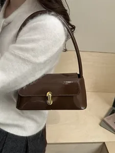 Retro dark brown patent leather shoulder bag with gold metal buckle for women
