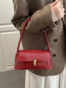 French vintage dark red patent leather baguette bag with a gold metal clasp for women
