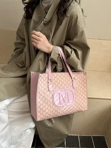 Pink monogram tote bag with repeating M-letter print and double top handles for women
