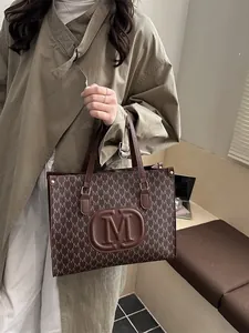 Classic monogram tote bag with brown leather handles for women's daily commute