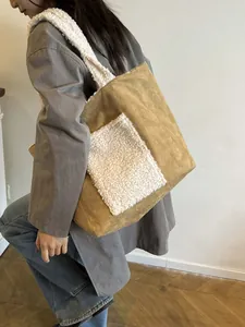 Brown fleece tote bag with white lamb wool shoulder strap and front pocket