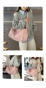 Pink waterproof fitness bag with adjustable strap and multi-pocket design shown on street