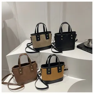 Minimalist bucket bags in four colors with quilted texture and gold rivet hardware