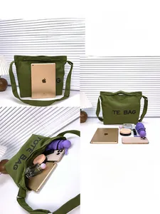Detail of army green canvas tote bag showing spacious interior for iPad and daily essentials