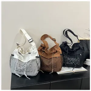 Detailed view of casual crossbody bags with ultra-letter print and mesh pockets