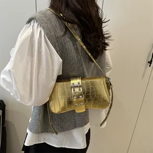 Metallic gold crocodile pattern underarm bag with metal buckle and grommet strap
