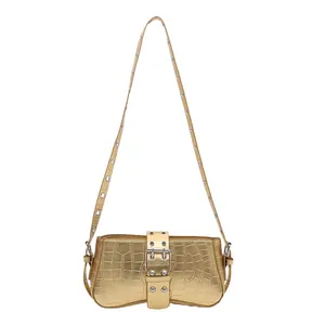 Metallic gold faux crocodile underarm bag with silver eyelet shoulder strap details