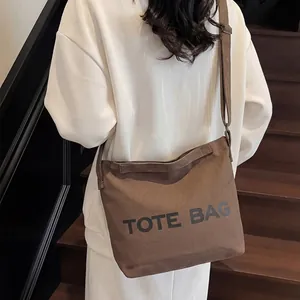 Coffee brown canvas tote bag with black TOTE BAG print for daily commute and casual style