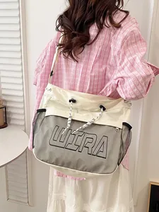 Off-white canvas crossbody bag with black mesh pocket and WIRA logo for casual street style