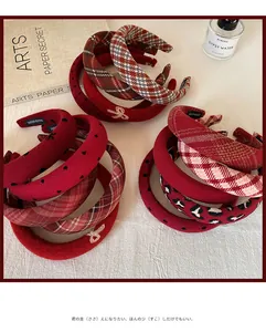 Detailed view of handmade festive red headbands in checkered and polka dot patterns