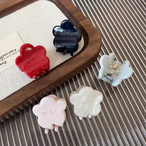 Five-piece set of cream-colored floral hair claws in various elegant matte finishes