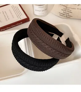 Detailed knit texture and soft woven pattern on black and brown retro headbands